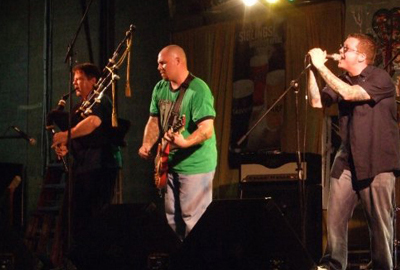 Tim Carey playing bagpipe at the irish festival