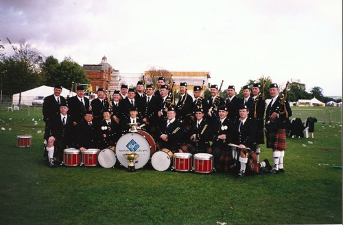 Tim Carey at Wold Championship with other bagpipers
